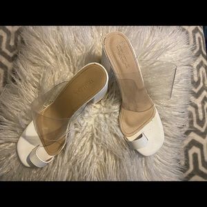 White block heels with a clear strap